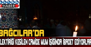 Elektriği kesilen camide mum ışığında ibadet ediyorlar