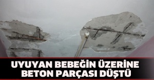 Uyuyan bebeğin üzerine beton parçası düştü