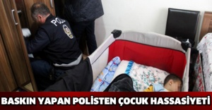 Baskın yapan polisten çocuk hassasiyeti